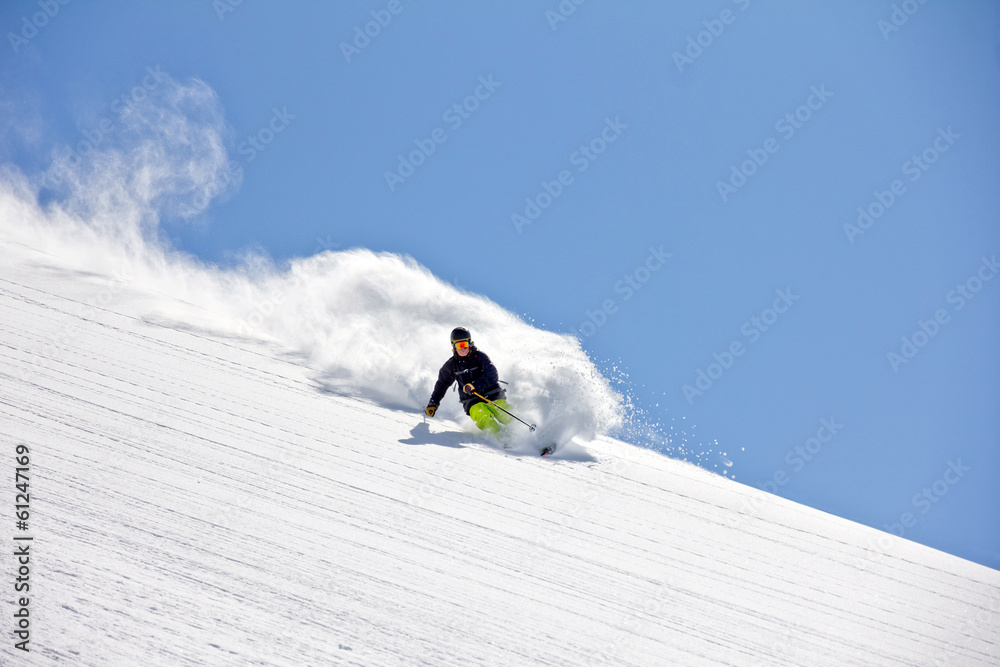 Skier in deep powder, extreme freeride