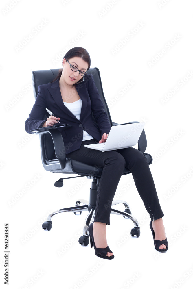 young business woman sitting on chair, working with laptop and t young business woman sitting on chair, working with laptop and t