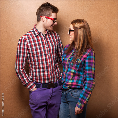 couple of guys dressed in clothes hipsters are in the studio