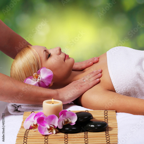 Spa Massage. Beautiful Blonde Woman Getting Body Massage