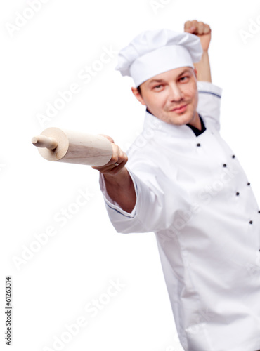 Cook in uniform with rolling pin