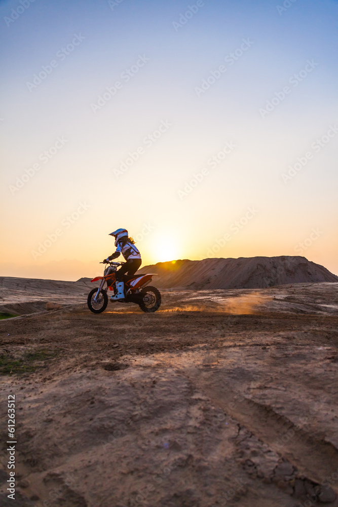 dusty desert racer on a motorcycle