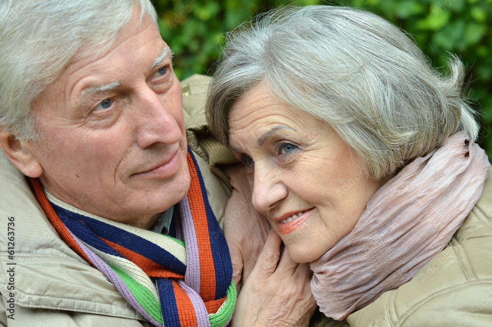 Mature couple walking in the park Mature couple walking in the park