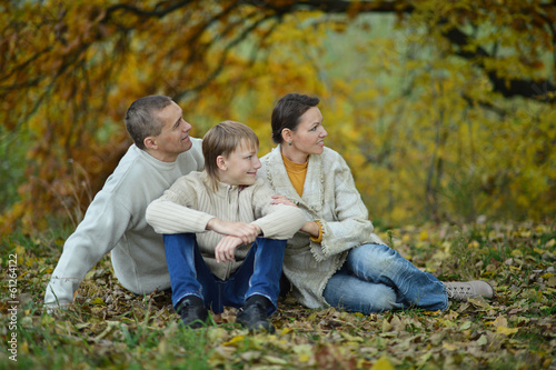 Happy family in park sitting © aletia2011