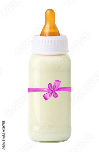 baby milk bottle with pink ribbon and bow isolated on white