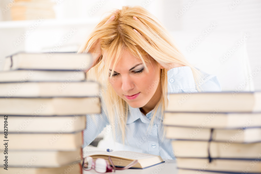 Beautiful Student girl learning between many books. Beautiful Student girl learning between many books.