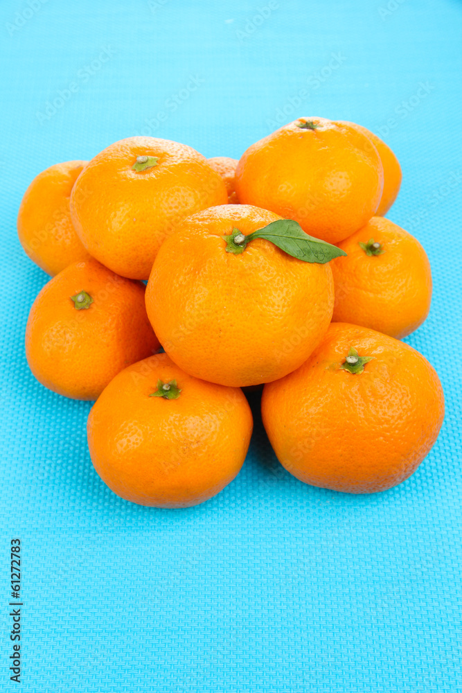 Ripe sweet tangerines, on color background Ripe sweet tangerines, on color background