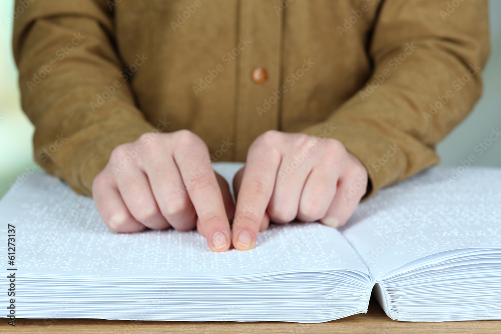 Blind woman read book written in Braille Blind woman read book written in Braille