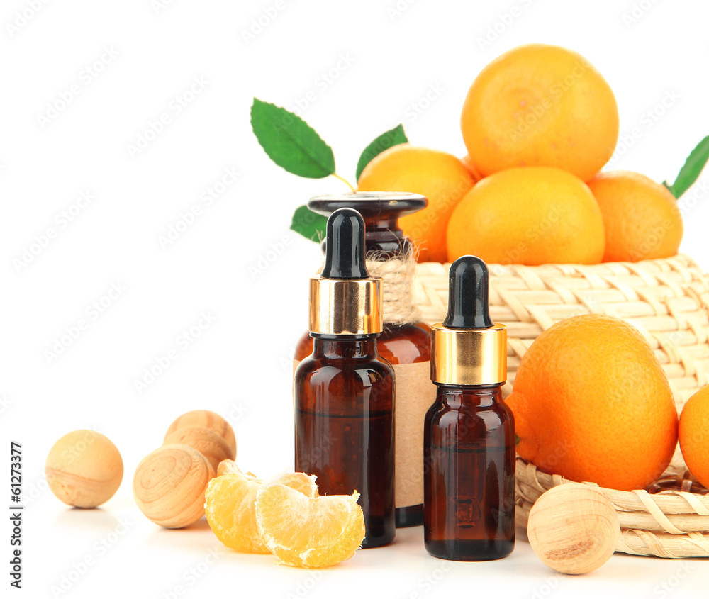 Tangerine essential oil and tangerines, isolated on white Tangerine essential oil and tangerines, isolated on white