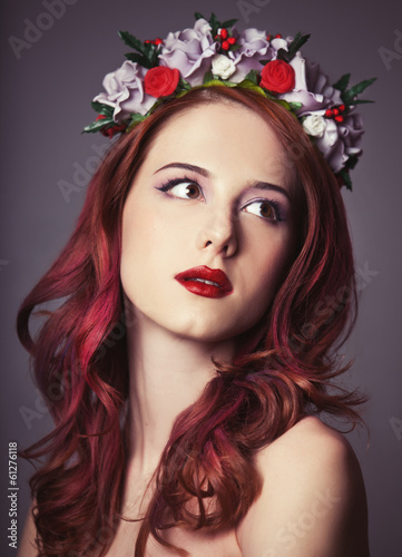 Beautiful redhead women with wreath.