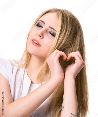 Girl showing heart shape with hands