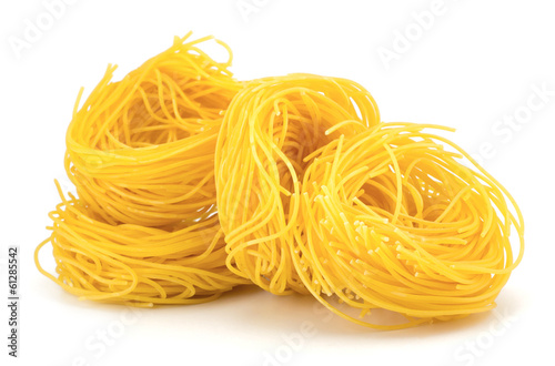 Italian egg pasta nest isolated on white background