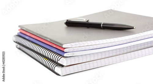 Notebook stack and pencils. Schoolchild and student studies acce