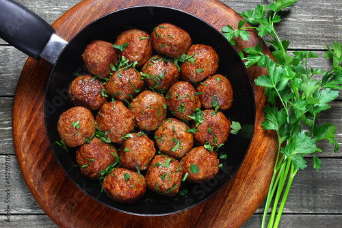 Fried pork meatballs in frying pan