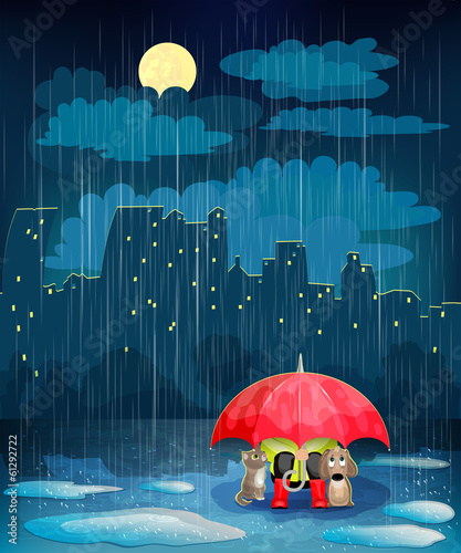 Child under an umbrella in night city.