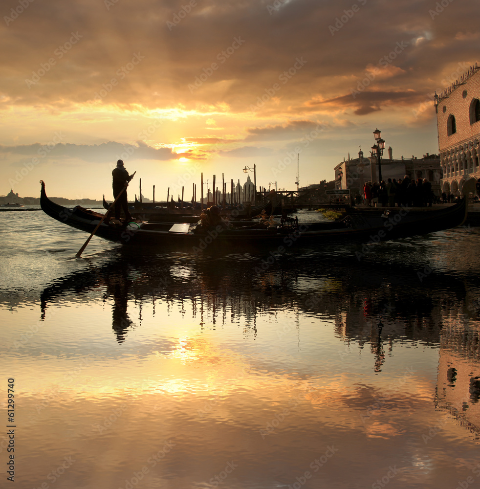 Obraz premium Venice with gondola against beautiful sunset in Italy