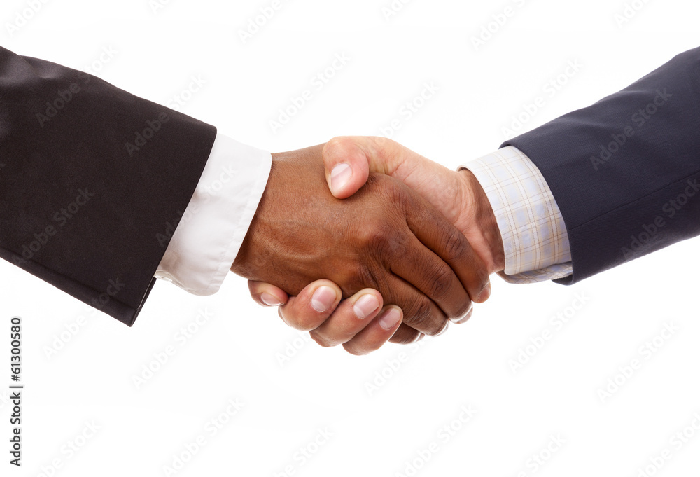 Handshake between african and a caucasian business man, isolated Handshake between african and a caucasian business man, isolated