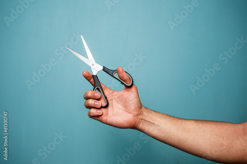 Holding scissors