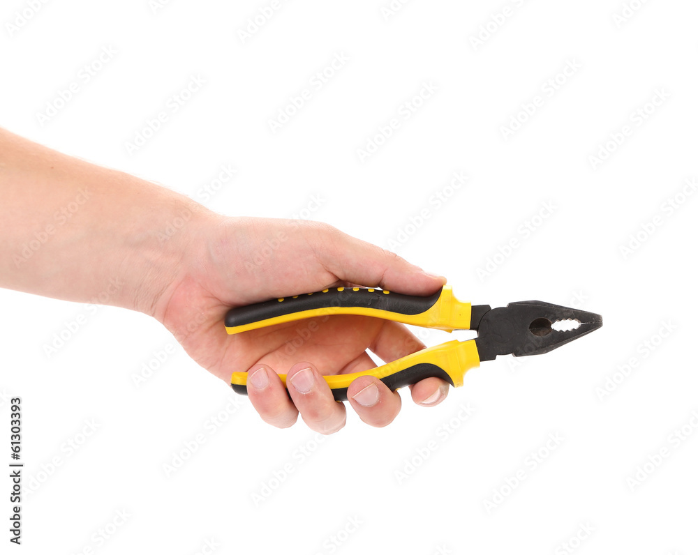 Obraz premium Hand holding pliers.