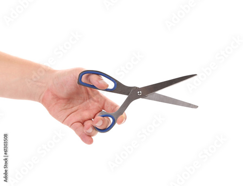 Male hand holding scissors.