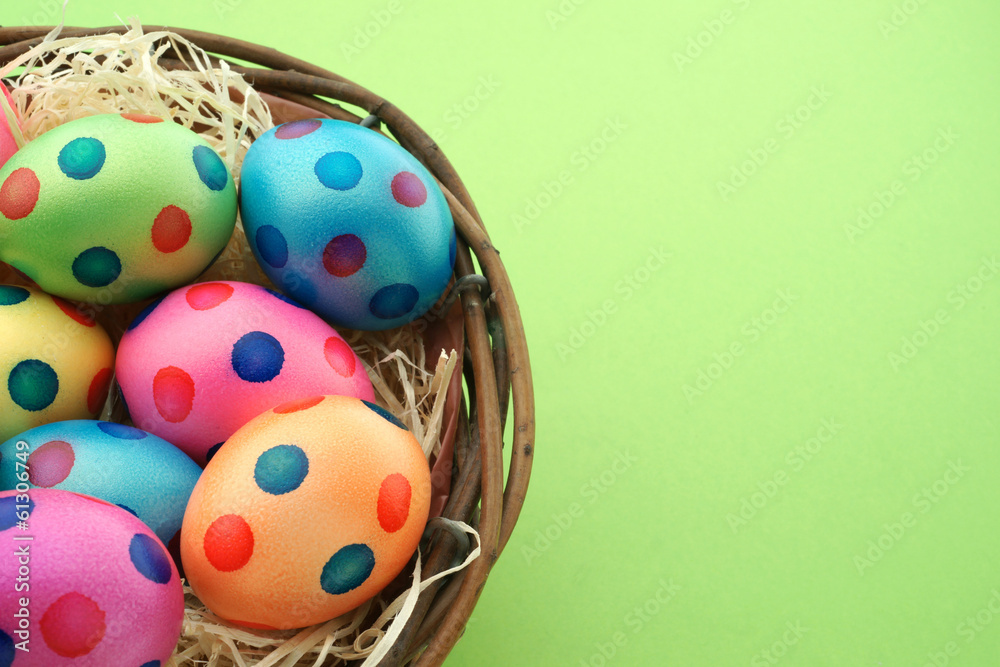 Colorful eggs with dots in easter nest