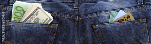 Φωτογραφία U.S. dollars, EURO and credit, debit card in the back jeans pock