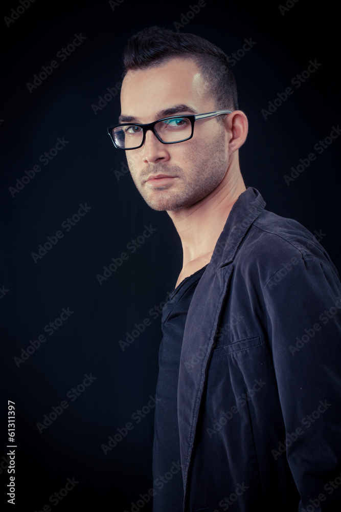 Obraz premium fashion portrait of the young beautiful man - dark background