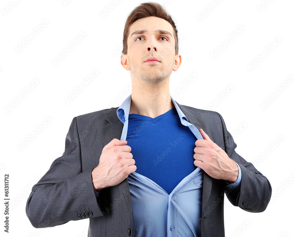 Young business man tearing apart his shirt revealing  superhero