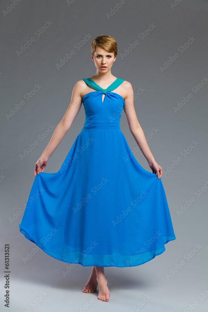 Fashion model posing in blue dress. Fashion model posing in blue dress.