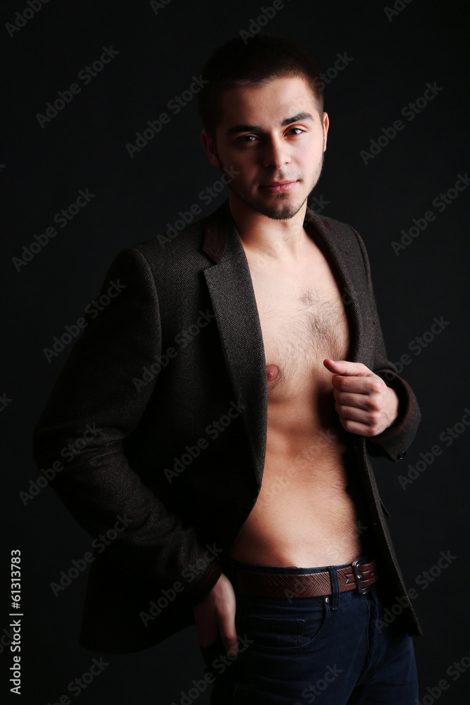 Obraz premium Handsome young man on dark background