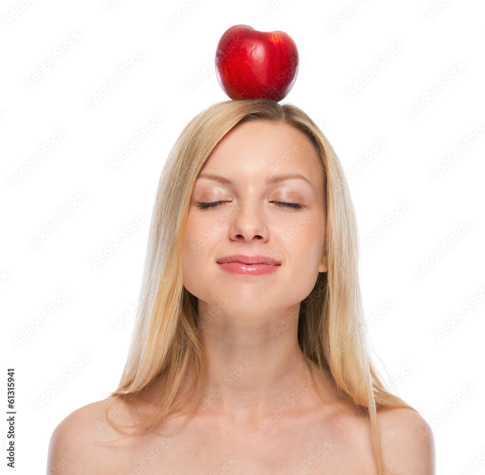Young woman with apple on head Young woman with apple on head