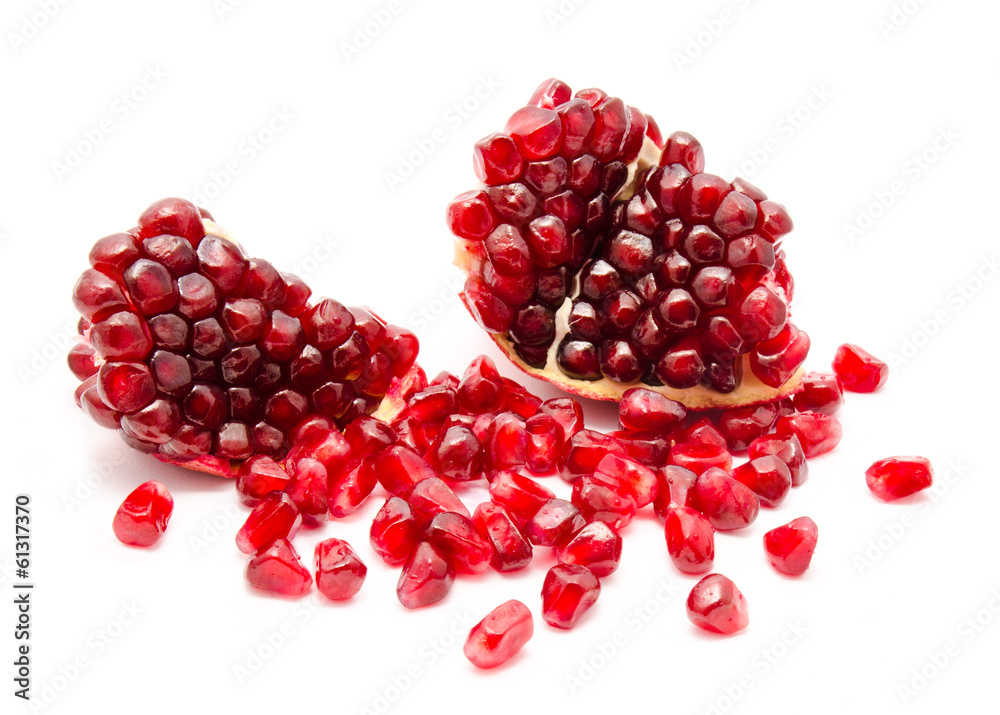 Ripe pomegranate fruit seeds isolated on a white Ripe pomegranate fruit seeds isolated on a white