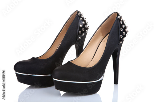 Black platform shoes with studs, isolated on white