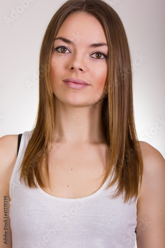 Portrait of a beautiful young woman in a white T-shirt