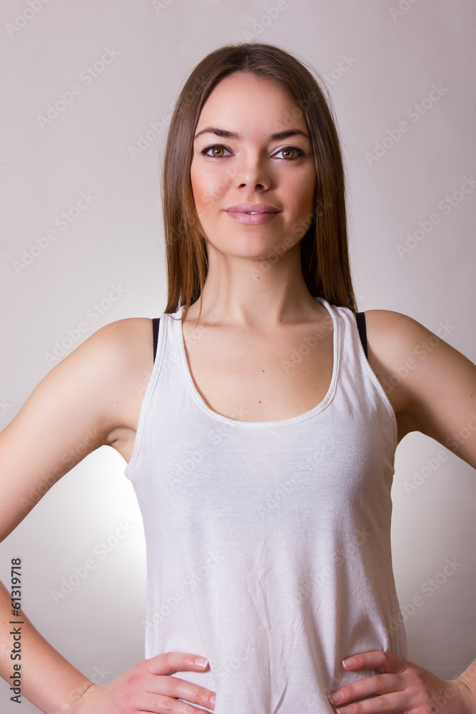 Portrait of a beautiful young woman in a white T-shirt Portrait of a beautiful young woman in a white T-shirt