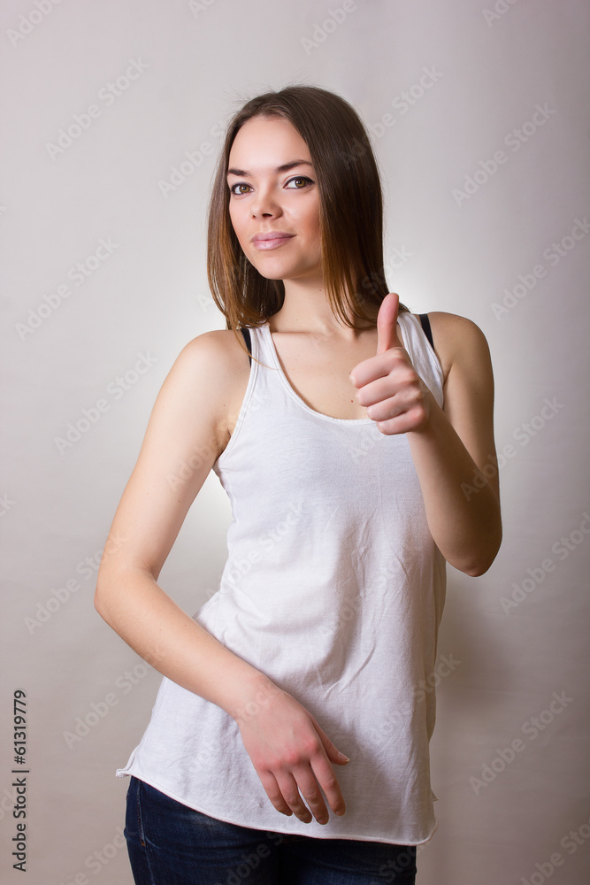 Portrait of a beautiful young woman in a white T-shirt Portrait of a beautiful young woman in a white T-shirt