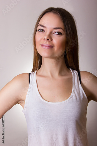 Portrait of a beautiful young woman in a white T-shirt