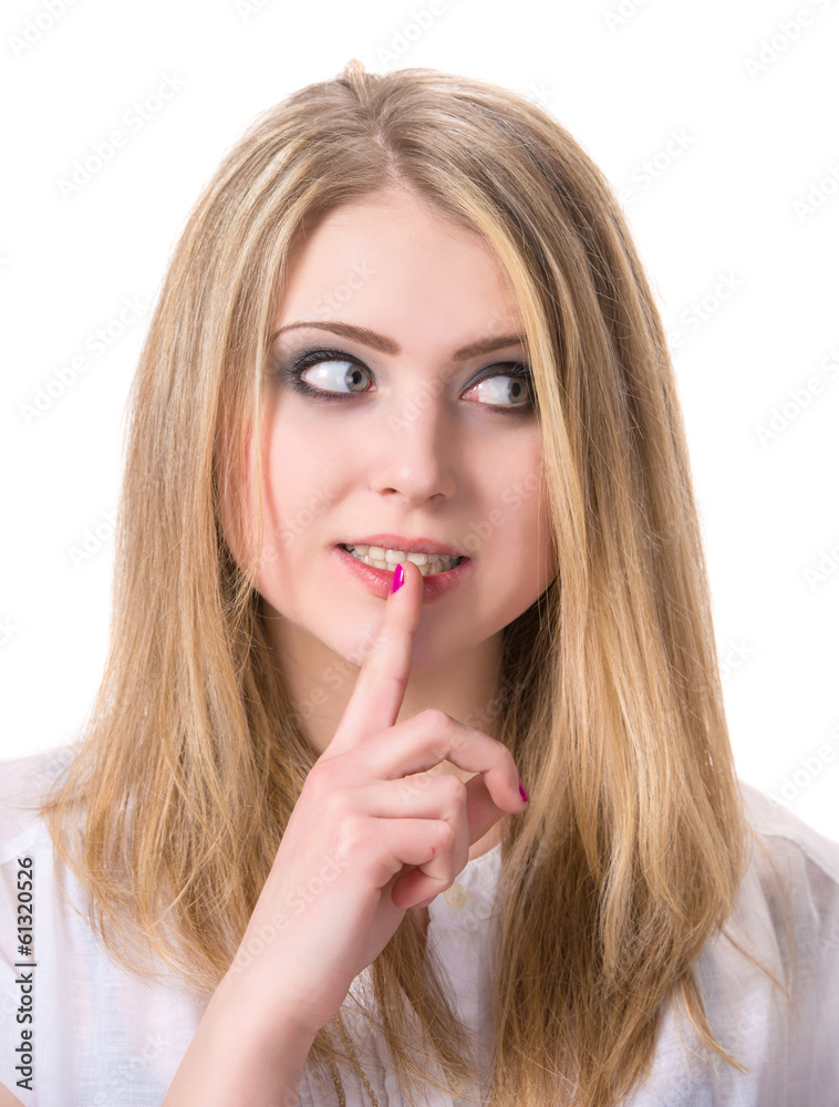 Young woman with finger on lips Young woman with finger on lips
