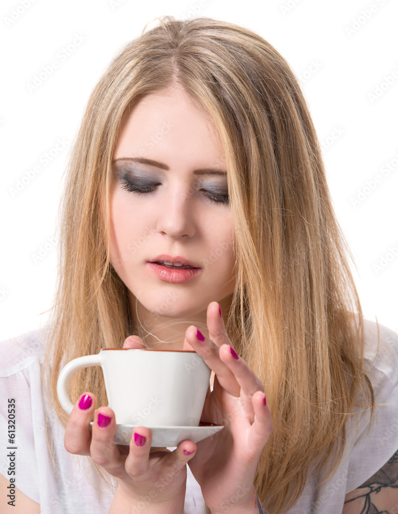 Beautiful girl enjoying coffee on a white background Beautiful girl enjoying coffee on a white background