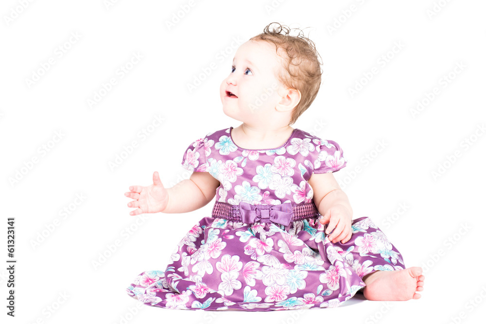 Beautiful little girl in a purple dress, isolated on white Beautiful little girl in a purple dress, isolated on white
