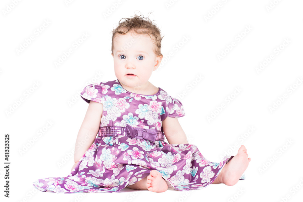 Sweet little baby girl in a festive purple dress, isolated on wh Sweet little baby girl in a festive purple dress, isolated on wh
