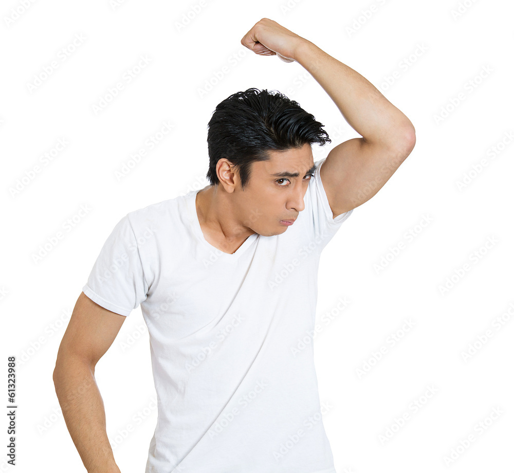 Man sniffing himself, very bad smell, odor Man sniffing himself, very bad smell, odor