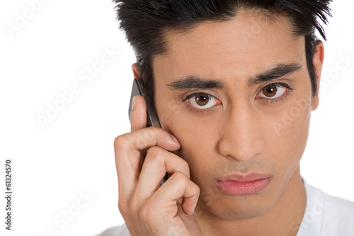 Sad depressed man receiving bad news on a phone