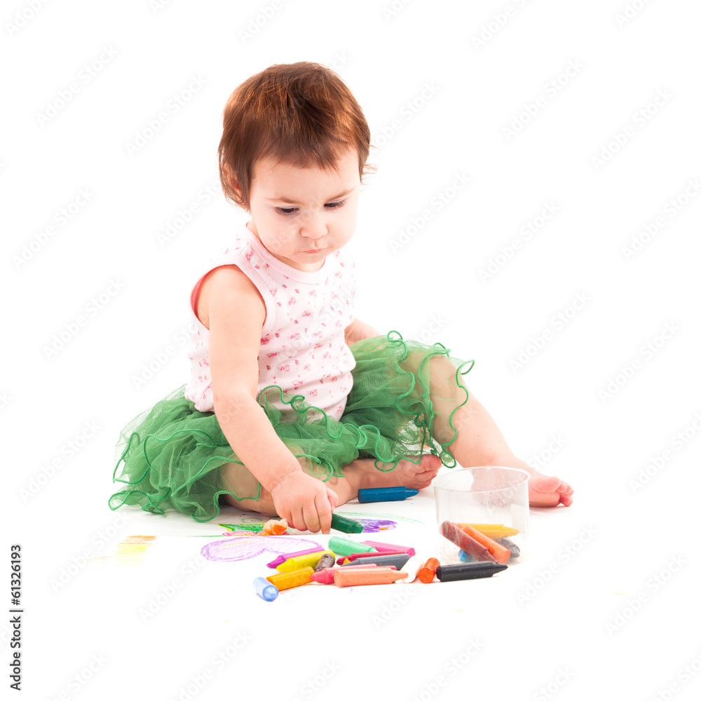 Toddler girl paints on the paper Toddler girl paints on the paper