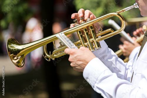 Musician blowing trumpet