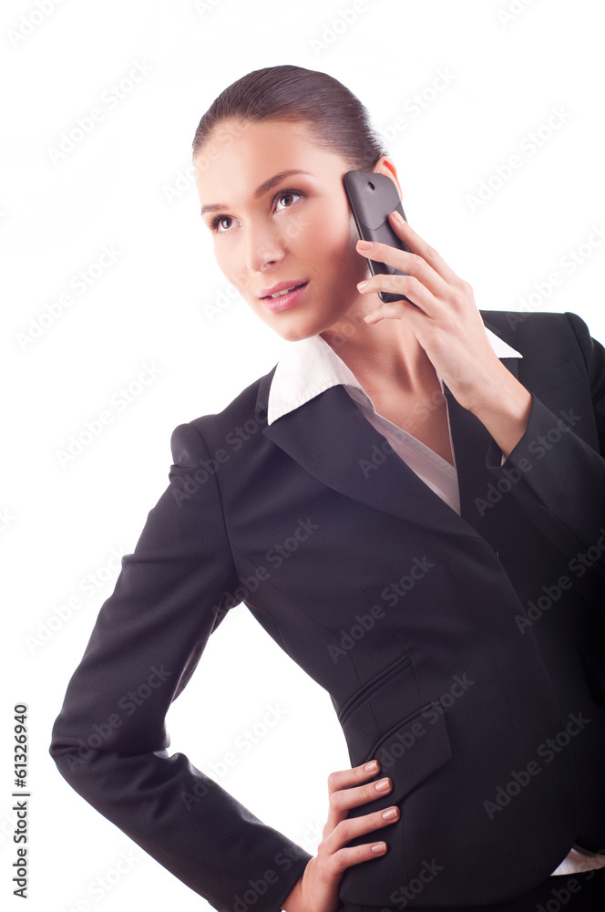 Smiling young business woman talking on the phone (isolated on w Smiling young business woman talking on the phone (isolated on w