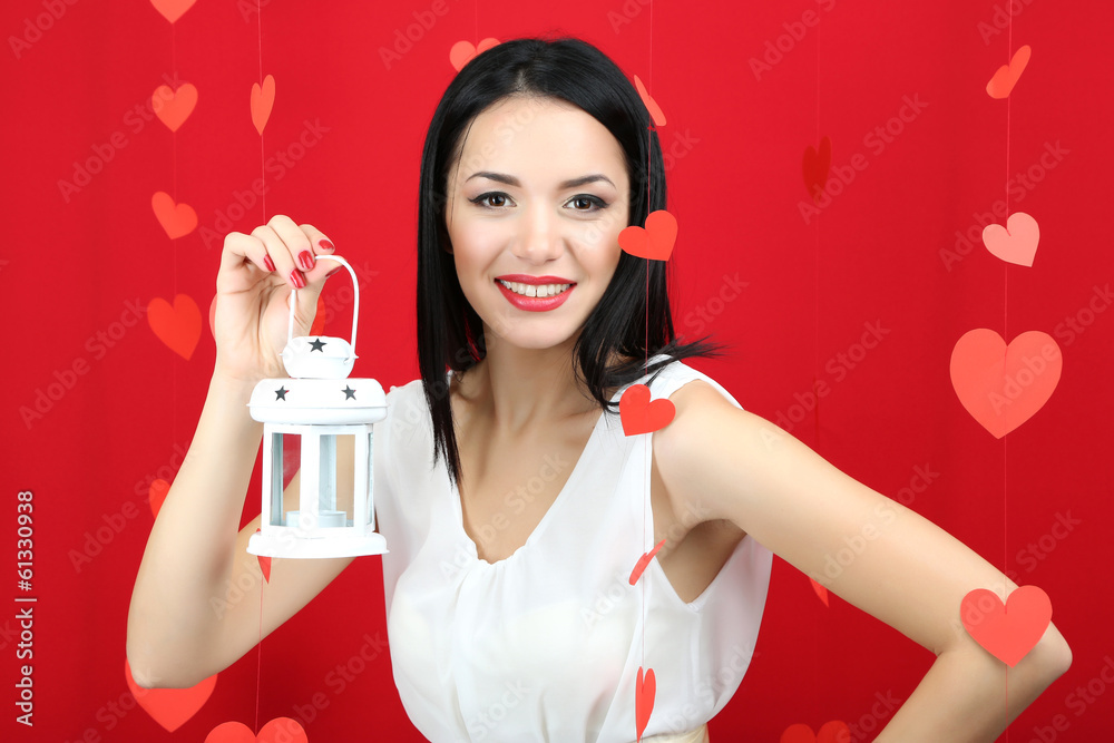 Attractive young woman with lantern on Valentine Day Attractive young woman with lantern on Valentine Day