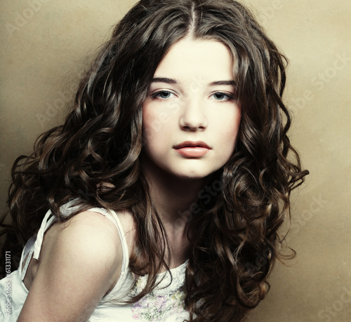 Image of beautiful young woman with curly hair