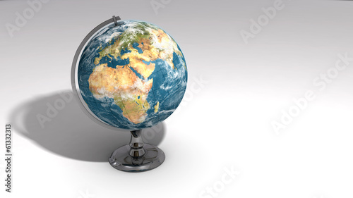 A realistic globe on a chrome pedestal over white C