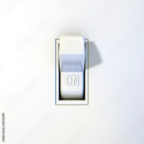 Close up of a wall light switch in the on position